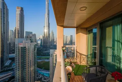 a balcony of a building with a view of a city at Downtown 1BR Full Burj Khalifa & Fountain Views in Dubai