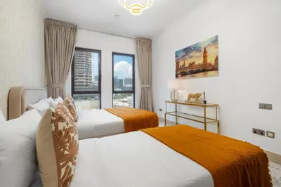 a bedroom with two beds and a window at 5 Minutes Dubai Mall - Burj Khalifa - View pools in Dubai
