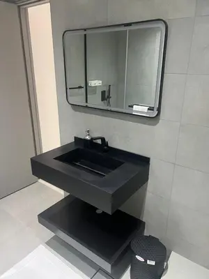a bathroom with a black sink and a mirror at Stunning Modern 1BR Apartment Lake View JLT Lake Terrace in Dubai