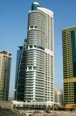 a tall building in a city with tall buildings at Stunning Modern 1BR Apartment Lake View JLT Lake Terrace in Dubai