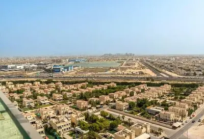 an aerial view of a city with buildings and a river at 15 min from Dubai Marina & JBR beach Studio apartment AZURE BINGHATTI JVC in Dubai