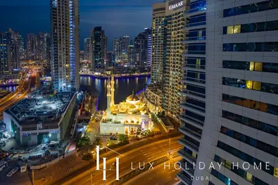 a view of a city at night at LUX The Sky Dubai Eye View Suite in Dubai
