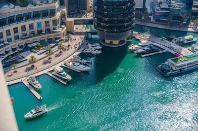 an aerial view of boats in a river in a city at Spacious 1BHK Apt with Canal View in Dubai Marina in Dubai