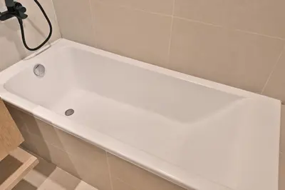 a white bath tub sitting in a bathroom at Golden Stays - Luxe 4BR Villa Family-Friendly and Fully Equipped in Dubai