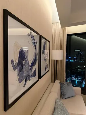 a living room with a couch and a window at Address Opera in Dubai