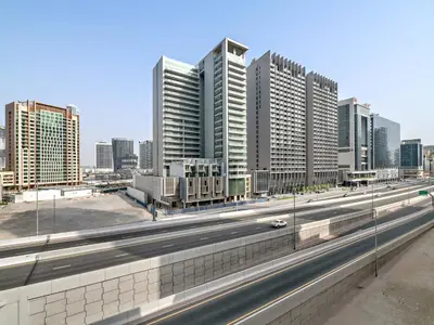 a highway in a city with tall buildings at Serene 1BDR Unit -Burj Views, Downtown in Dubai