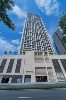 a tall white building with a blue sky in the background at Burj Khalifa View 2BR Luxury Apartment in Dubai in Dubai