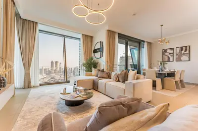 a living room with a couch and a table at High Floor with Direct Burj Khalifa and Fountain Views, Just Steps from Dubai Mall and Metro Station - Burj Vista Tower 1, Downtown Dubai by Deluxe Holiday Homes in Dubai