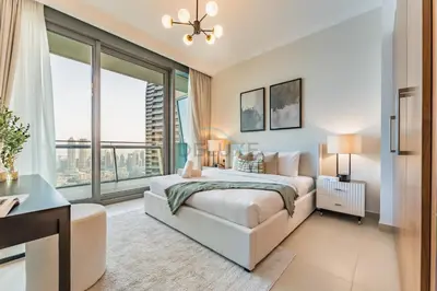 a bedroom with a bed and a large window at High Floor with Direct Burj Khalifa and Fountain Views, Just Steps from Dubai Mall and Metro Station - Burj Vista Tower 1, Downtown Dubai by Deluxe Holiday Homes in Dubai