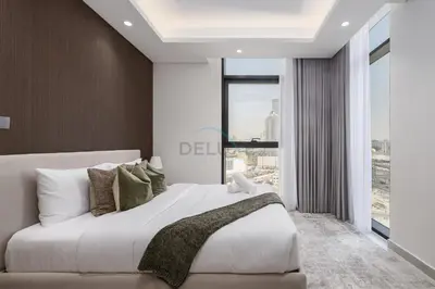 a bedroom with a large bed and a large window at Modern 1BR Haven Near the Park, Offering Effortless Connectivity to Key Roads, Cloud A, Jumeirah Village Triangle by Deluxe Holiday Homes in Dubai