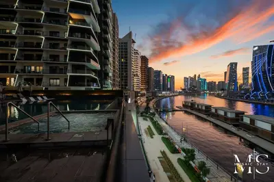 a view of a river in a city with buildings at Luxury High Floor 1BHK Burj and Canal Views in Dubai