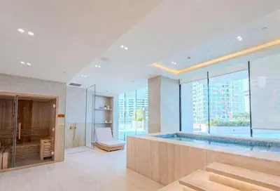 a bathroom with a large swimming pool with a large window at TRPS - Binghatti Royale, JVC - Private Pool, Luxury Furnished, Brand New in Dubai