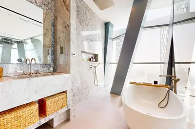 a bathroom with a large tub and a sink at Vacationer l Magnificent 4 Bedroom l Penthouse l Marina Views in Dubai