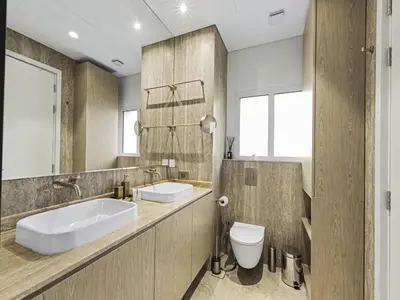 a bathroom with a sink and a toilet in it at Redwood Townhouse Jumeirah Golf Estates in Dubai
