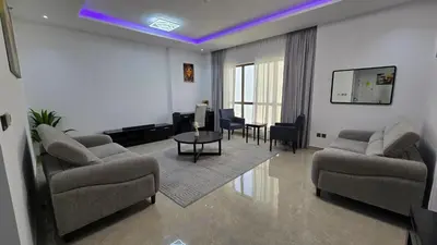 a living room with two couches and a table at Beach, Palm Jumeirah & Marina view in Dubai