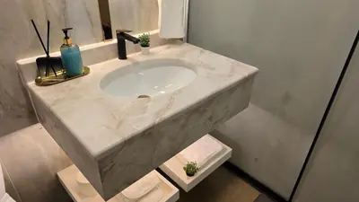 a white sink in a bathroom with a counter at Beach, Palm Jumeirah & Marina view in Dubai