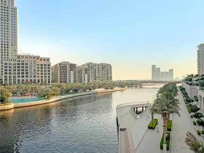 a view of a river in a city with buildings at FIRST CLASS 1BR Creek Escape & Modern Elegance in Dubai