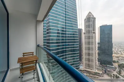 a balcony with a view of a city at GuestReady - 1BR | Elegant Duplex | JLT in Dubai