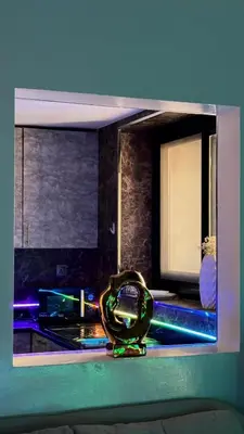 a view of a kitchen with a ring on a counter at Futuristic luxury apartment, 360 lake view balcony in Dubai