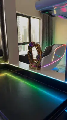 a mirror on a table in a room at Futuristic luxury apartment, 360 lake view balcony in Dubai