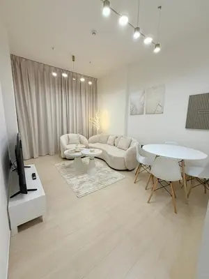 a living room with a couch and a table at Luxury Binghatti Crest 1BR Apartment with Pool & Balconies in Dubai