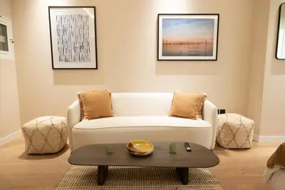 a living room with a couch and a coffee table at Chic studio located in the heart of Business Bay in Dubai