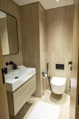 a bathroom with a white toilet and a sink at Chic studio located in the heart of Business Bay in Dubai