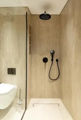 a bathroom with a shower with a toilet and a sink at Chic studio located in the heart of Business Bay in Dubai