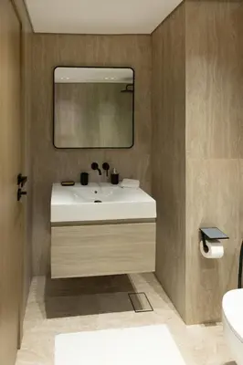 a bathroom with a sink and a mirror at Chic studio located in the heart of Business Bay in Dubai