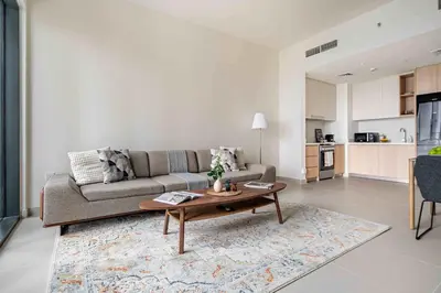 a living room with a couch and a coffee table at Frank Porter - Island Park 2 in Dubai