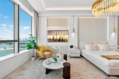 a living room with a bed and a large window at DVH Luxe Retreats at The Palm Tower, Palm Jumeirah, Studio Apartment in Dubai