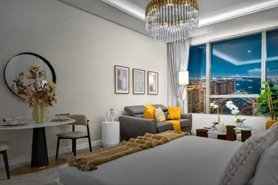 a living room with a couch and a chandelier at DVH Luxe Retreats at The Palm Tower, Palm Jumeirah, Studio Apartment in Dubai