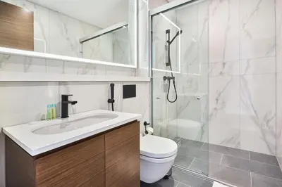 a bathroom with a toilet and a sink and a shower at STAY BY LATINEM Luxury 3BR Holiday Home CA 0702 Near Burj Khalifa in Dubai