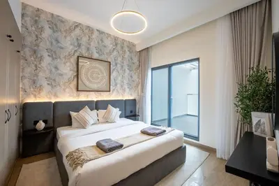 a bedroom with a large bed and a large window at Santorini Damac Lagoons Luxury 3BR Villa Mediterrean Bliss in Dubai