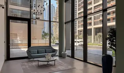 a living room with a couch and a table at Burj Khalifa and Canal view 2 BDR Apartment in Dubai