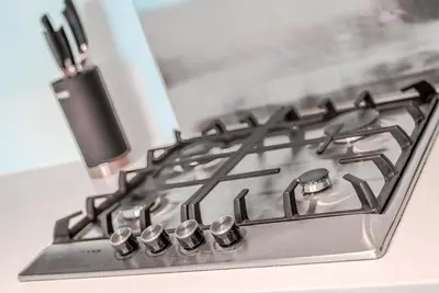 a stove top with a cell phone on top of it at TRPS - Uppercrest, Downtown - Burj Khalifa View, Furnished, Near Dubai Mall in Dubai