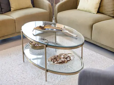 a glass coffee table in a living room with two couches at Livin' Holidays - 1 BR - Stunning Private beach in Dubai