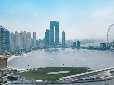 a view of a city with a large body of water at Livin' Holidays - 1 BR - Stunning Private beach in Dubai
