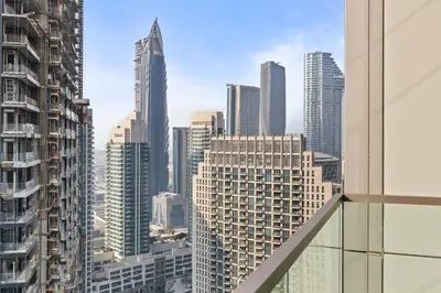a view of a city skyline from a skyscraper at Versace 1BR Downtown Burj View From Infinity Pool in Dubai