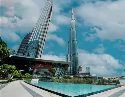 a view of the burj khalifa and the city at Versace 1BR Downtown Burj View From Infinity Pool in Dubai