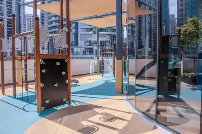 a playground on the roof of a building at Versace 1BR Downtown Burj View From Infinity Pool in Dubai