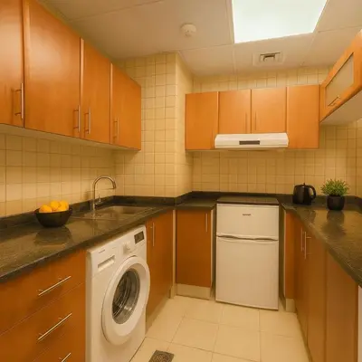 a kitchen with a washer and a dishwasher at Luxury studio in Dubai Marina in Dubai