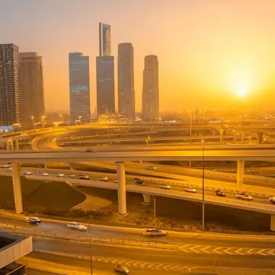 a freeway with traffic in a city with tall buildings at Luxury studio in Dubai Marina in Dubai
