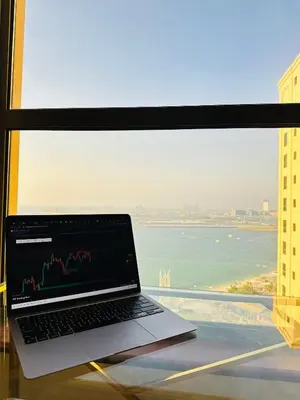 a laptop computer sitting on a table in front of a window at Luxury studio in Dubai Marina in Dubai