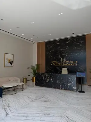 a lobby with a large painting on the wall at High floor luxury apartment JVC in Dubai