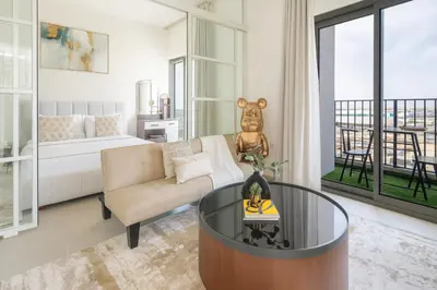 a living room with a couch and a coffee table at Cozy 2BR Apartment in Dubai Hills with Cinema and Lounge Access in Dubai