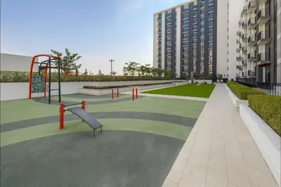 a park with a playground in a building at Cozy 2BR Apartment in Dubai Hills with Cinema and Lounge Access in Dubai