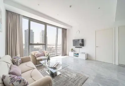 a living room with a couch and a table at Test Property - NoBookings in Dubai