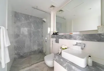 a bathroom with a sink and a shower and a toilet at Test Property - NoBookings in Dubai