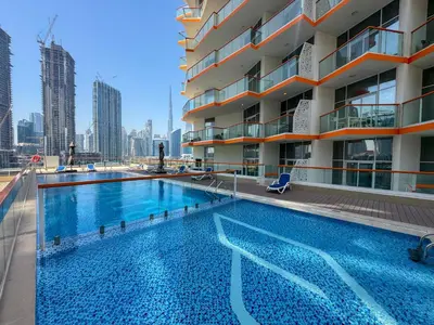 a swimming pool on the roof of a building at Stylish Apartment with Swimming Pool Near Dubai Mall and Burj Khalifa in Dubai